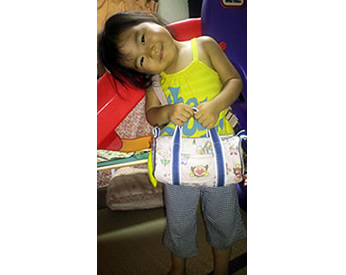 アンパンマンの生地で作ったドラム型のポシェット